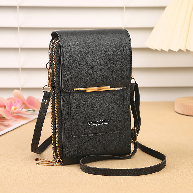 Eliza touch screen phone bag in black, front view with shoulder strap