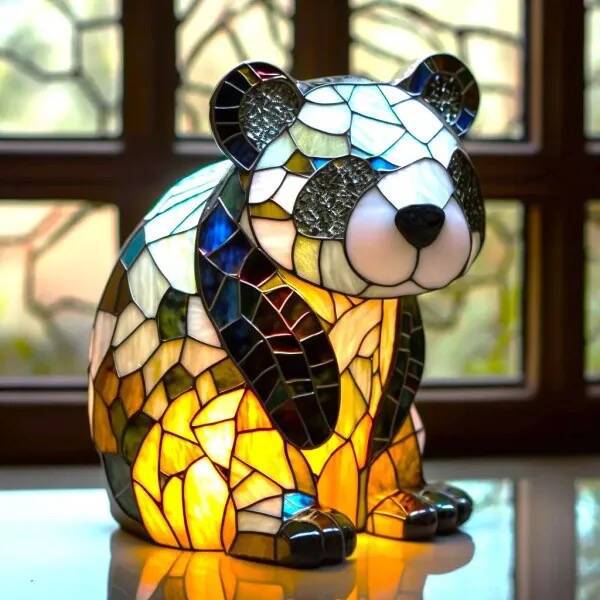 Playful panda glow lamp in stained-glass style resin, lit on a windowsill