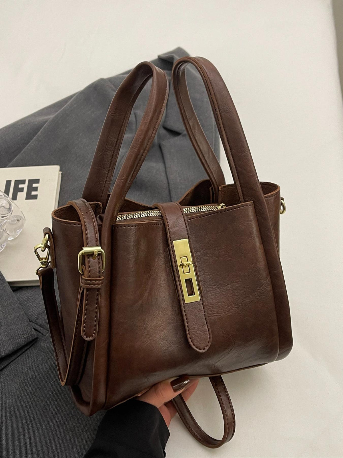 Gypsy retro crossbody handbag in coffee brown, angled view