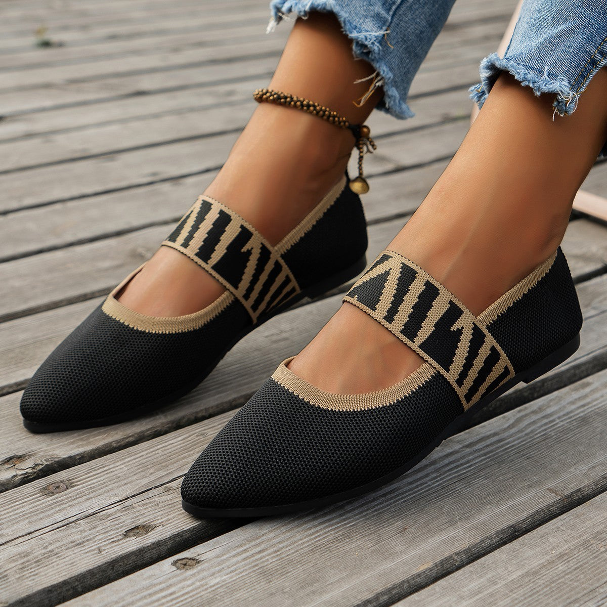 Ilyana patterned ballet flats in black, worn pointed-toe view
