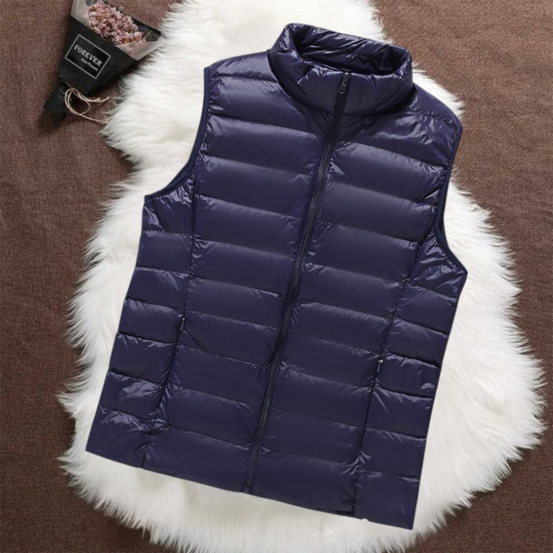 Isa padded gilet in navy blue, flat front view with stand collar and zip