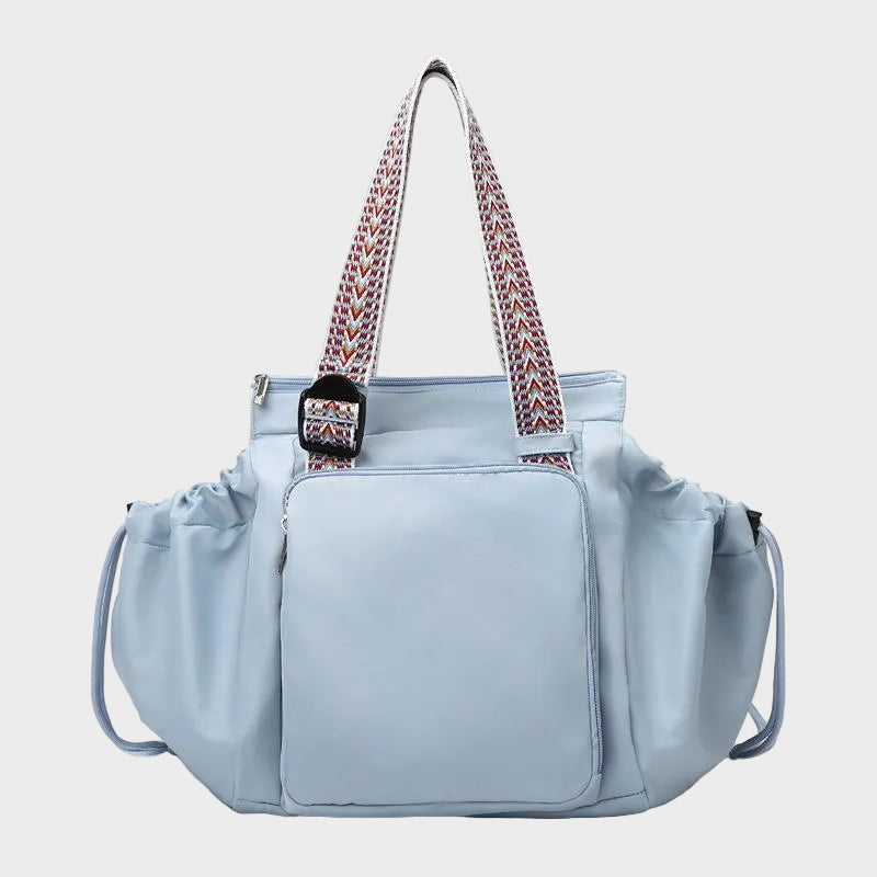 Ezra Pack Tote in light blue with woven straps, front view