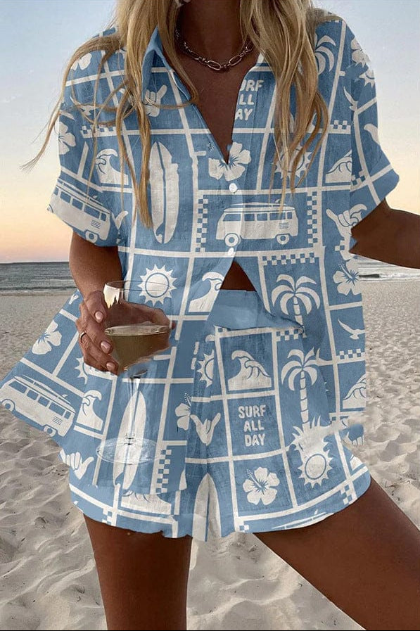 Malibu summer co-ord set in sky blue with white surf print, front view on the beach