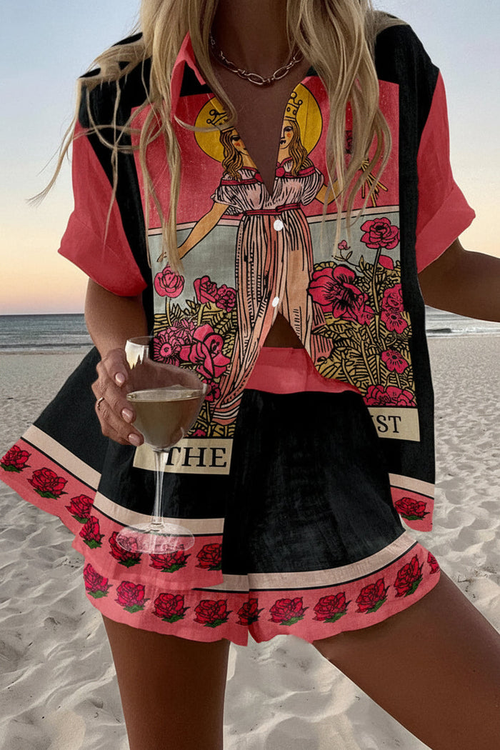 Oracle summer co-ord set in black and coral tarot print, front view on the beach