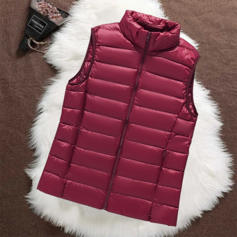 Isa padded gilet in dark red, quilted front view with stand collar and zip