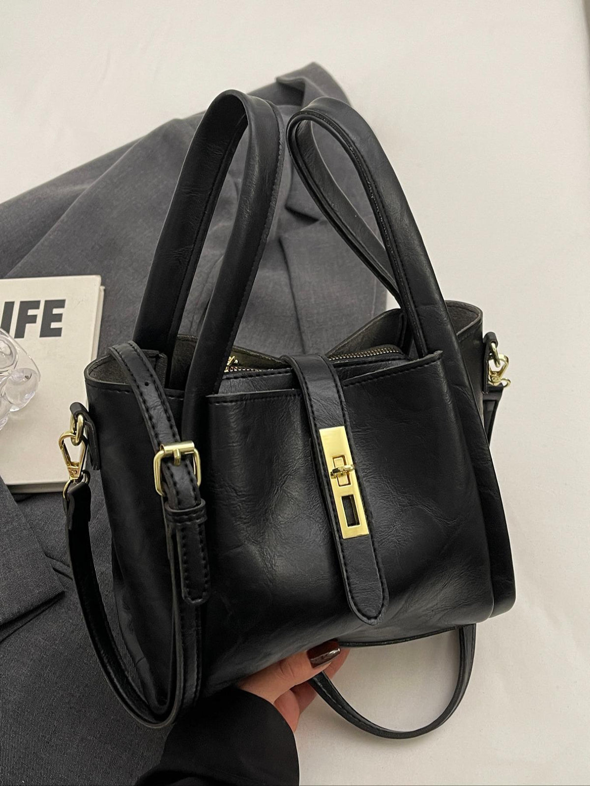 Gypsy retro crossbody handbag in black, top angled view with zip