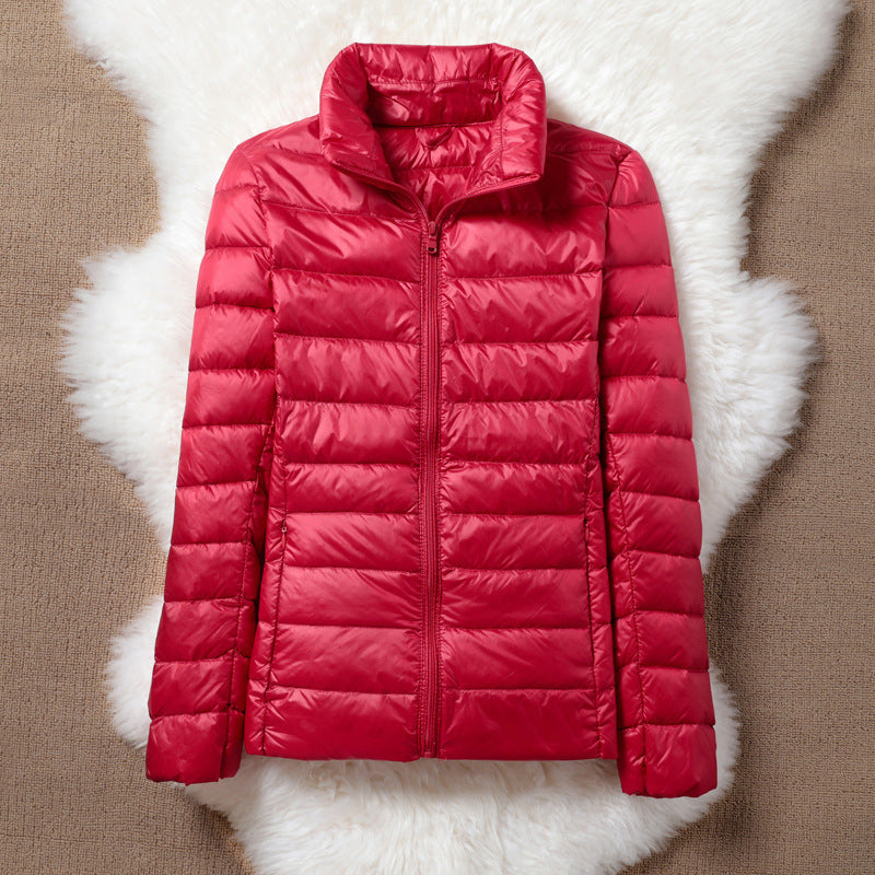 Ulla transitional jacket in red, flat front view with zip closed