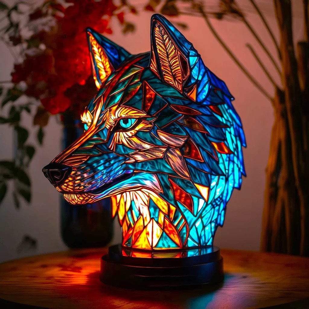 Guardian Wolf glow lamp in blue and amber stained-glass effect, lit on a wooden table