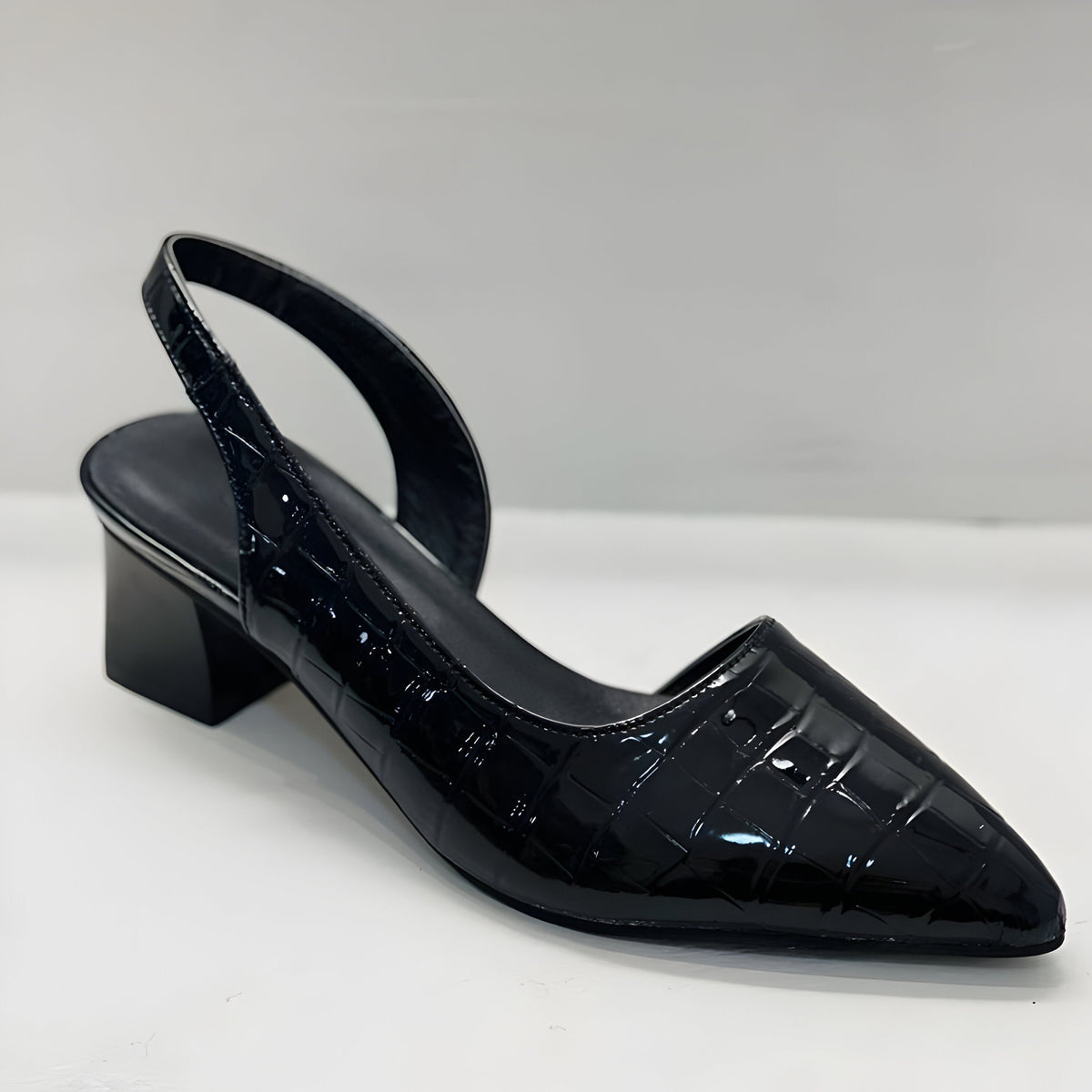 Victoria black court shoe showing pointed toe and block heel