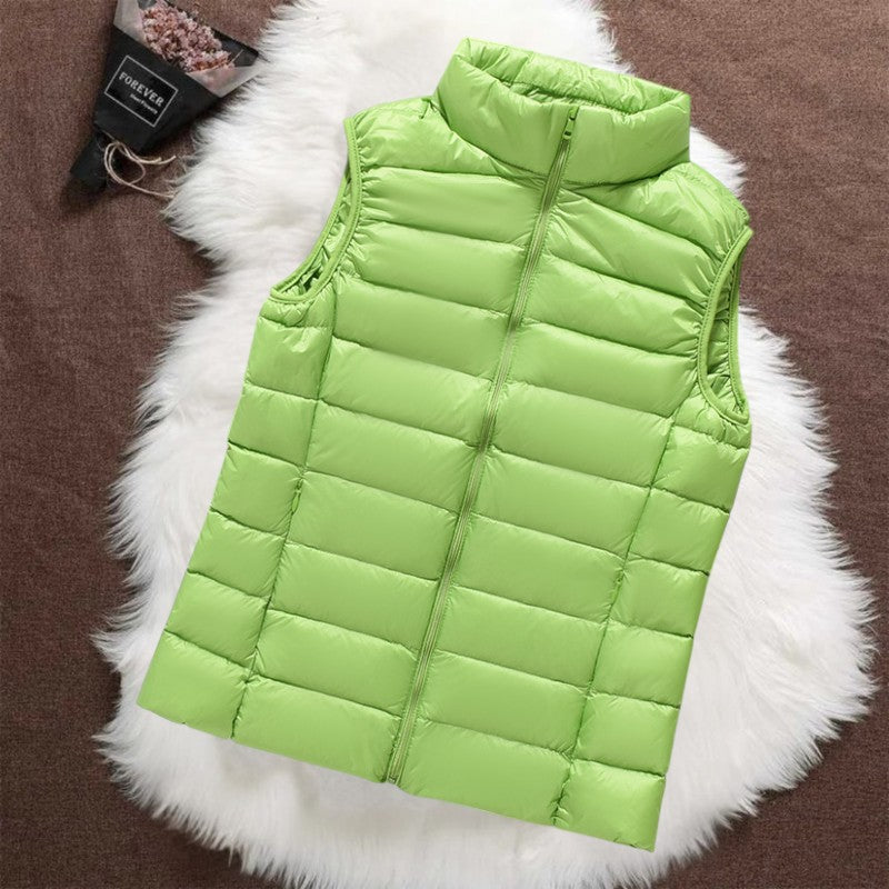 Isa padded gilet in green, front view with zip and quilted panels