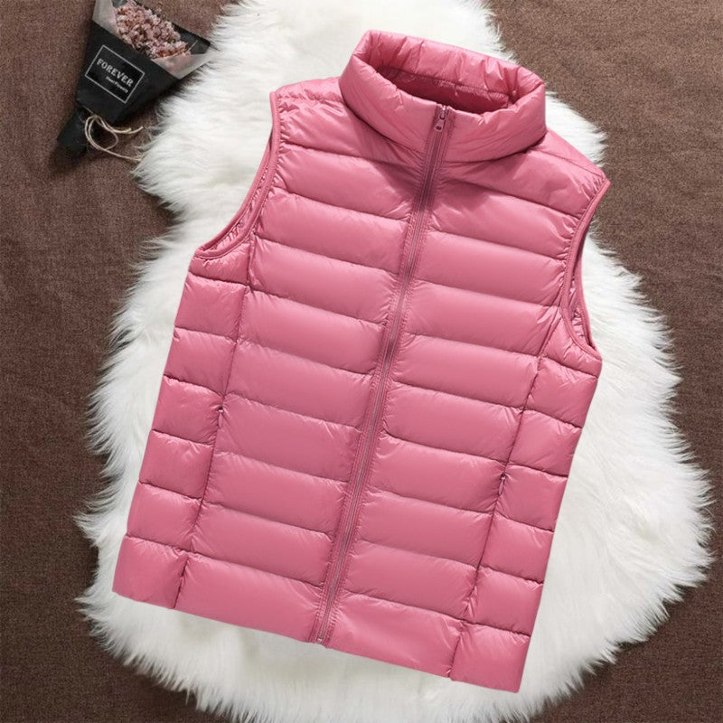 Isa padded gilet in salmon pink, flat front view with stand-up collar and zip