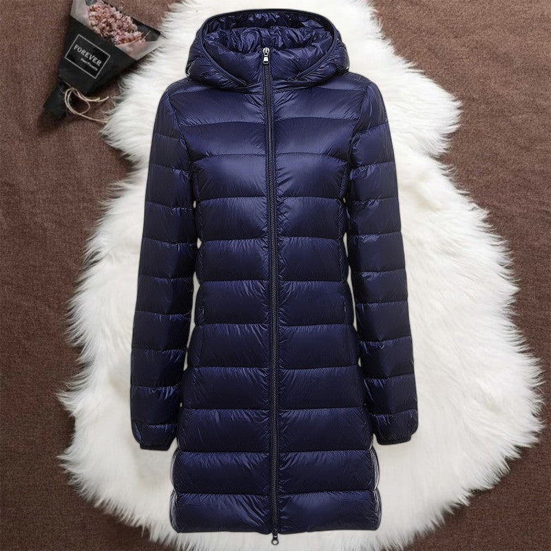 Helsa long padded jacket in navy blue, flat product view with zip and hood