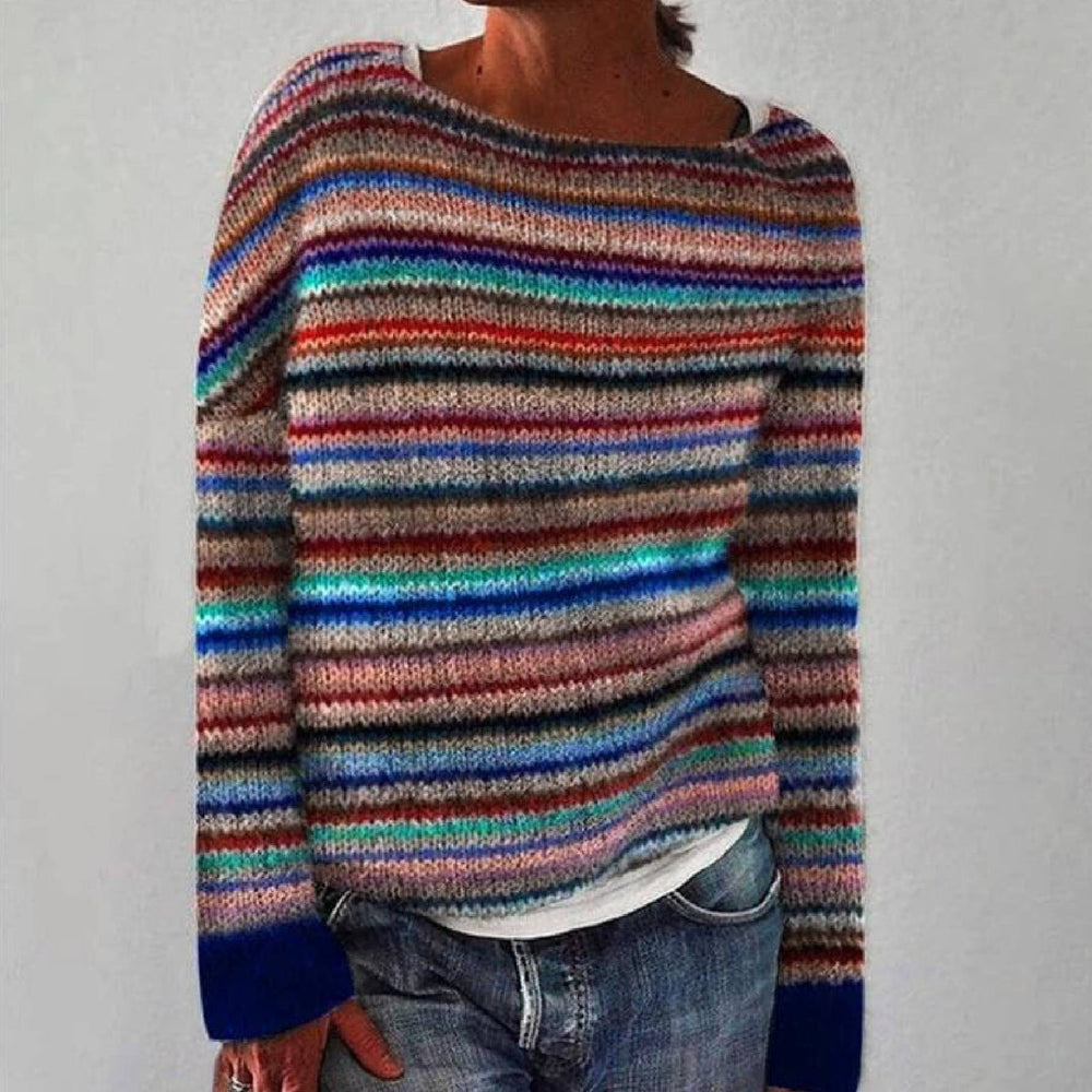 Maya retro knitted sweater in multicoloured stripes, front view worn with jeans