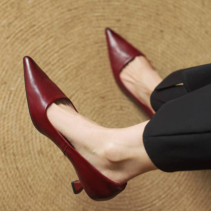 Sarah pointed toe pumps in red, close-up worn view