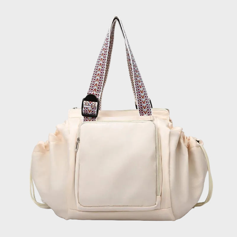 Ezra Pack Tote in off-white with patterned straps, front view