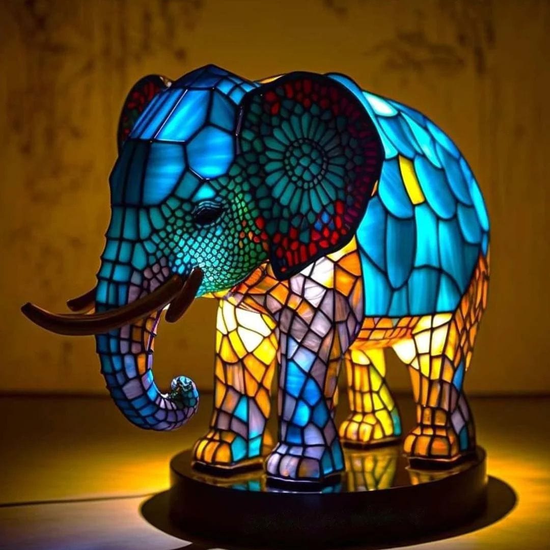 Royal glowing elephant lamp in blue and gold stained-glass style, lit side view