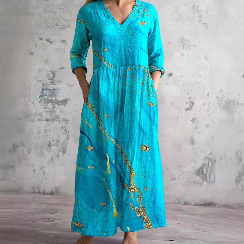 Willow floral summer maxi dress in turquoise blue with gold print, full-length front view