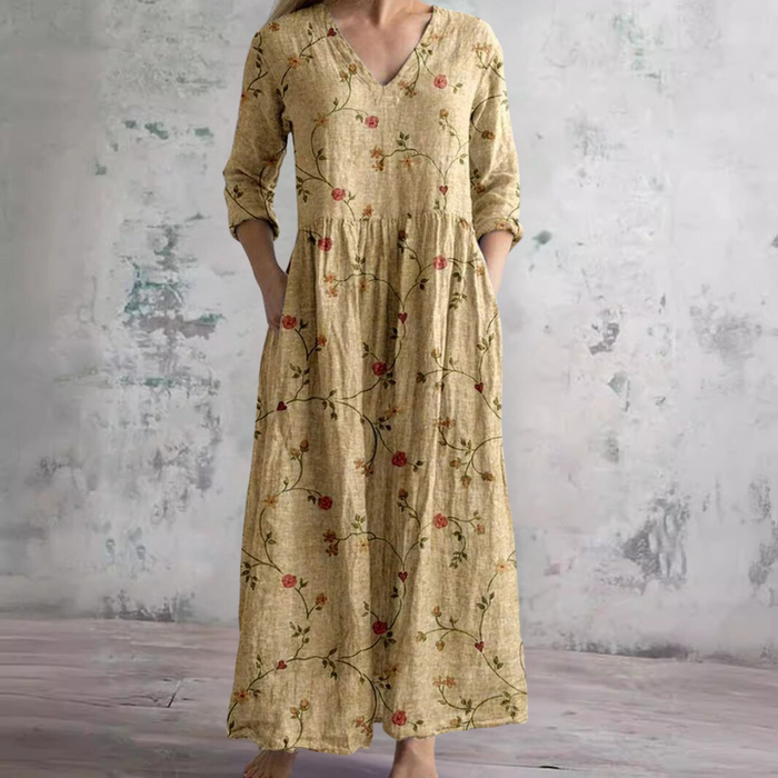 Erica floral maxi dress in yellow, full-length front view with side pockets