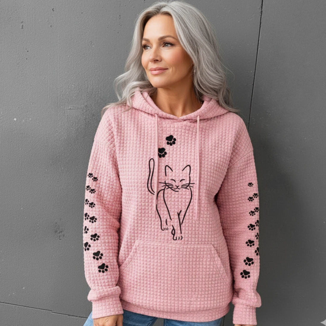 Savannah cat print hoodie in pink, worn full front view