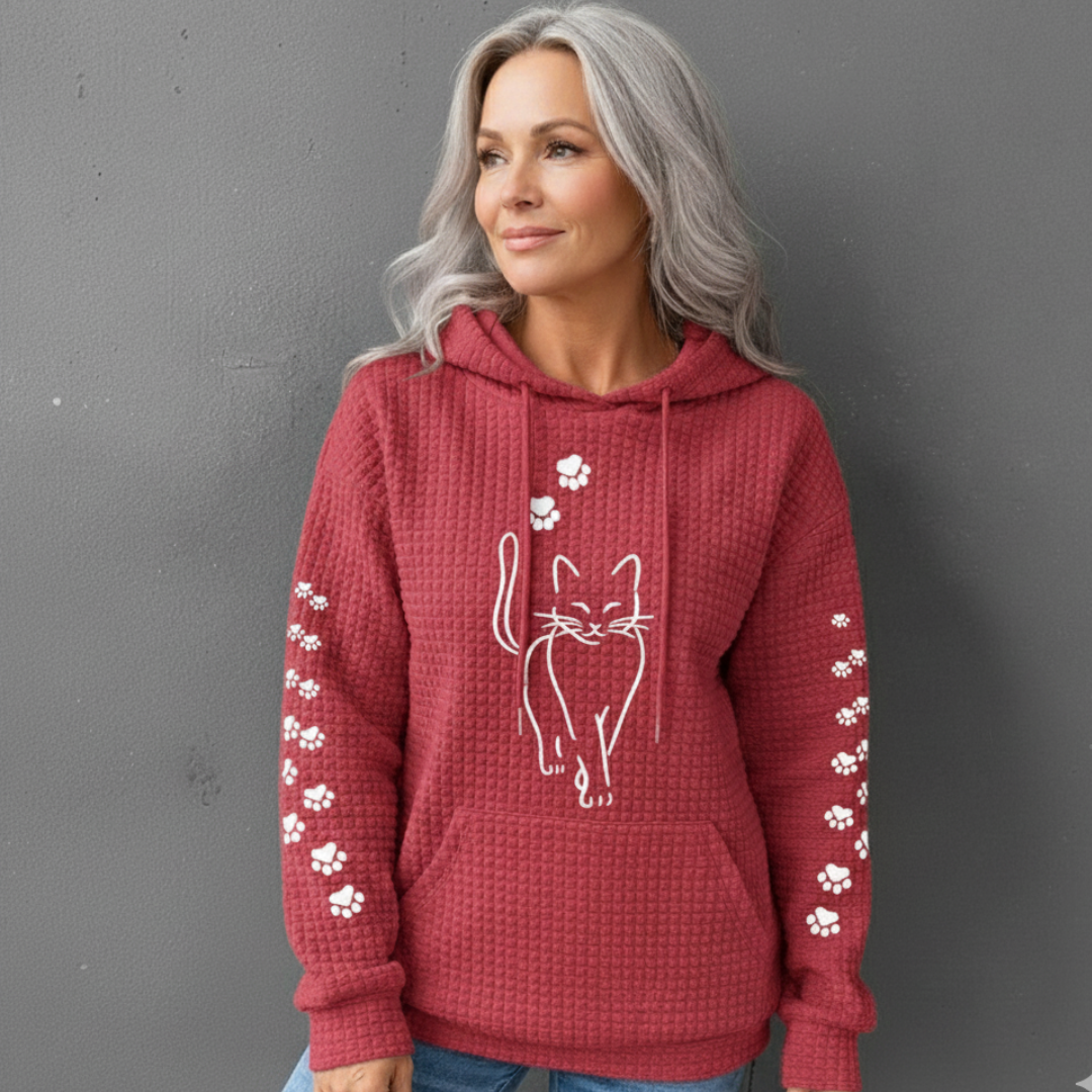 Savannah cat print hoodie in red, worn full front view