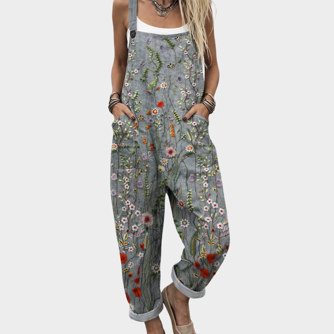 Comfortable printed dungarees in grey floral, full-length front view with turn-up hems