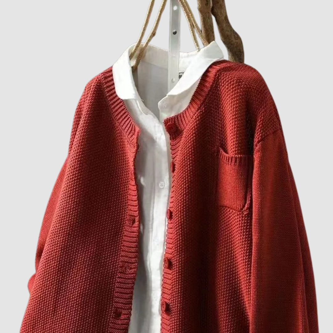 Elowira knit cardigan in red, close-up of ribbed placket and pocket