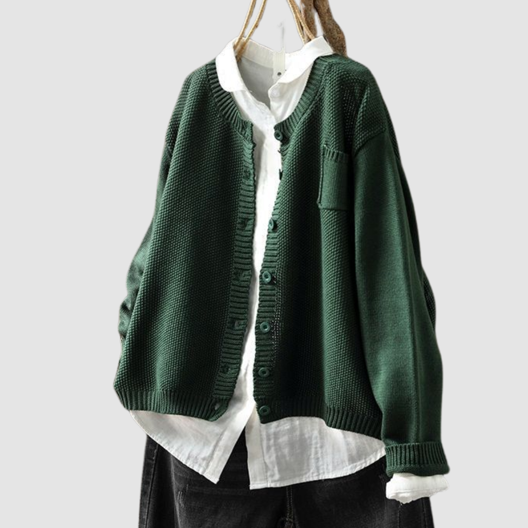 Elowira cosy knit cardigan in green, front view over white shirt