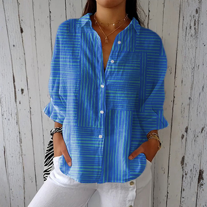 Clara modern stripe blouse in blue, front view worn with white trousers