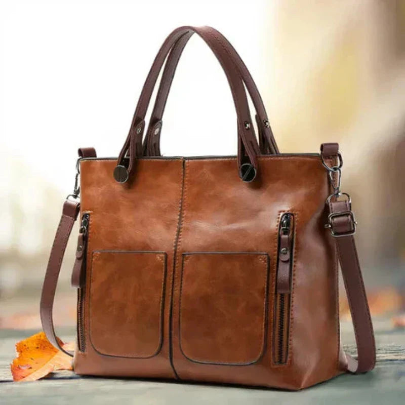 Maeva stylish leather bag in brown, front view with twin handles
