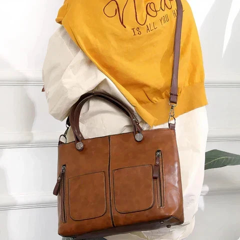 Maeva bag in brown worn crossbody with the shoulder strap