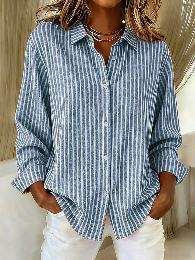 Jimena striped button-up shirt in blue, front view with white trousers