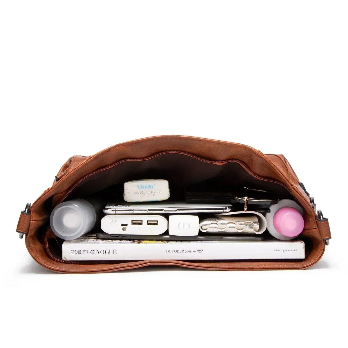 Junia everyday leather bag in brown, interior filled with daily essentials