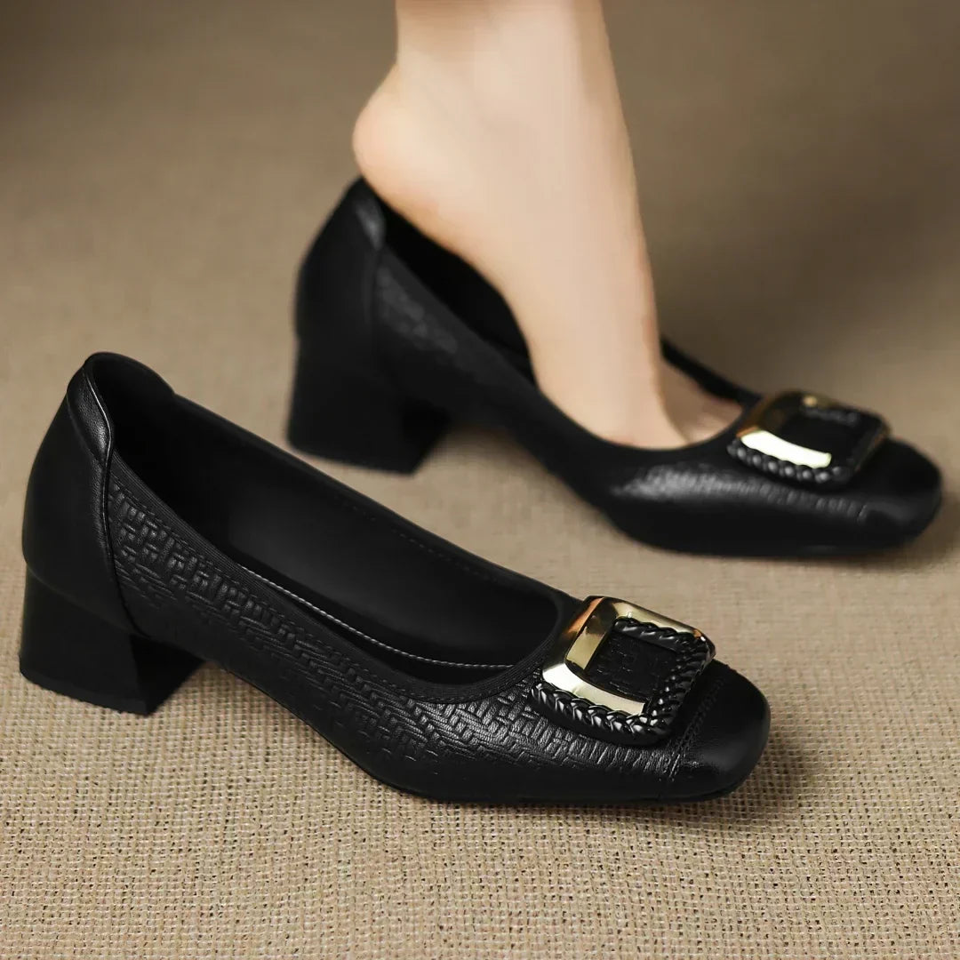 Novalisse heels in black, worn on the foot, front view