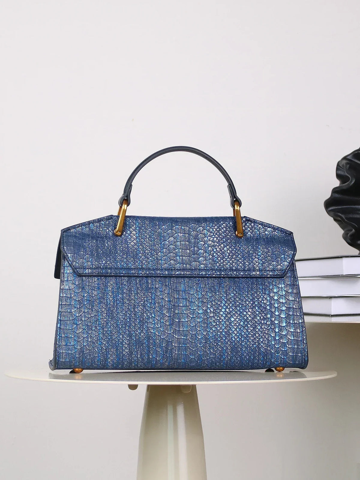 Selene python tote bag in royal blue, back view on table
