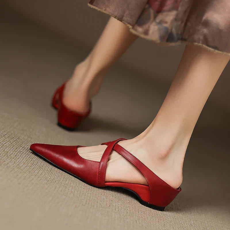 Aluna pointed-toe mules in maroon, walking view showing block heel
