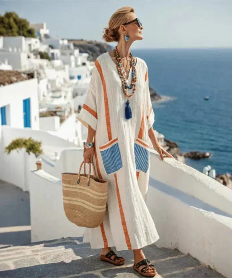 Vera maxi kaftan dress in cream with orange and blue stripes, side view