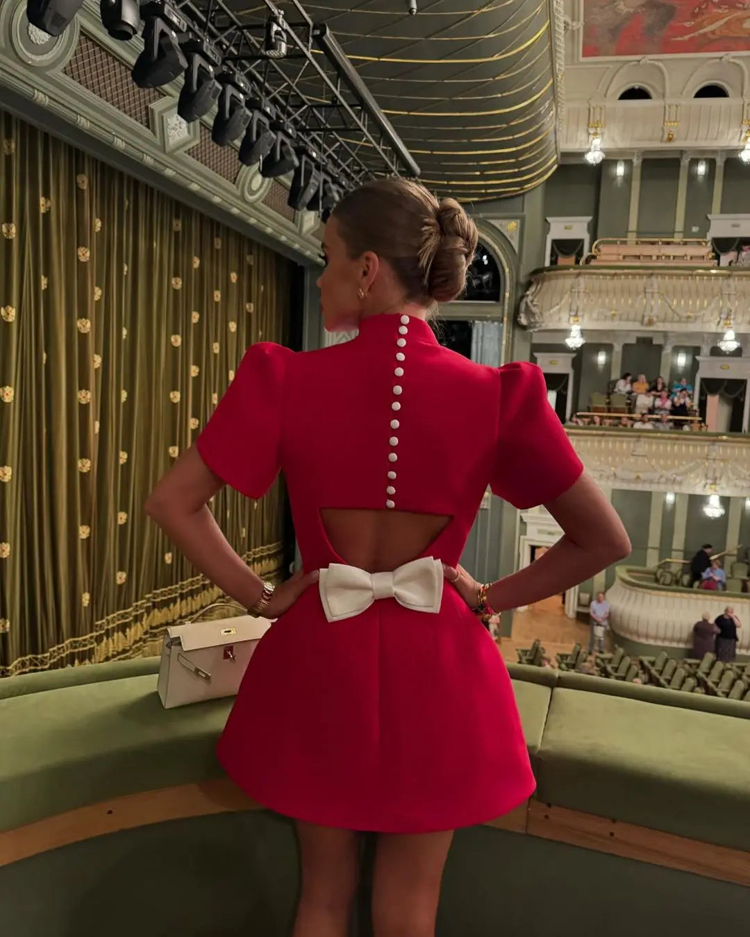 Laila skater dress in red, back view with cut-out and bow