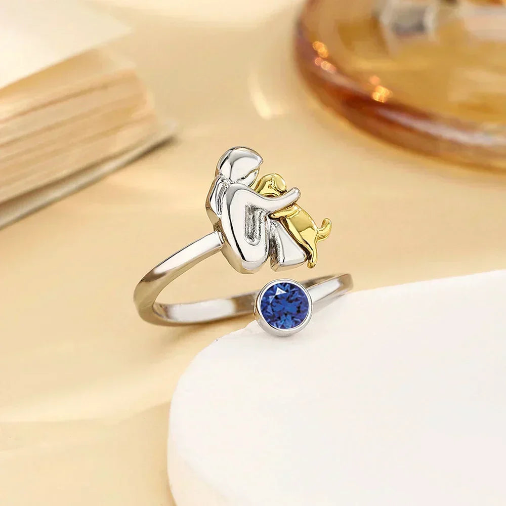 Vesporra dog icon ring with blue gemstone, angled view