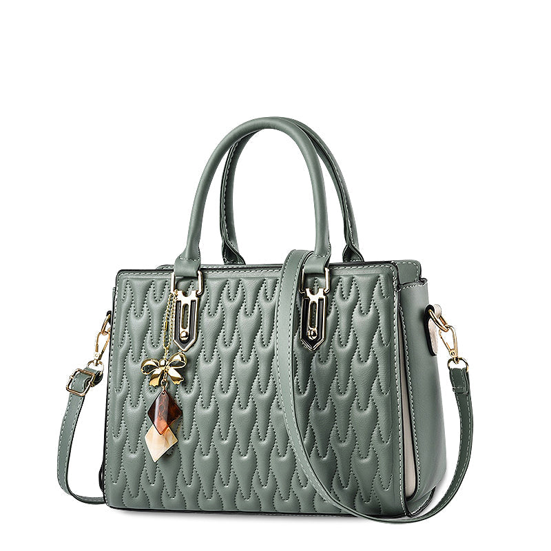 Vellora shoulder handbag in green, angled front view