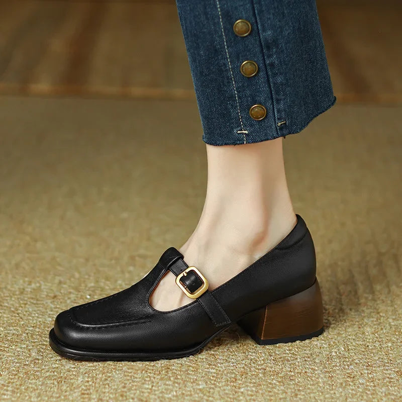 Selvana T-strap shoes in black, close-up of buckle strap and toe