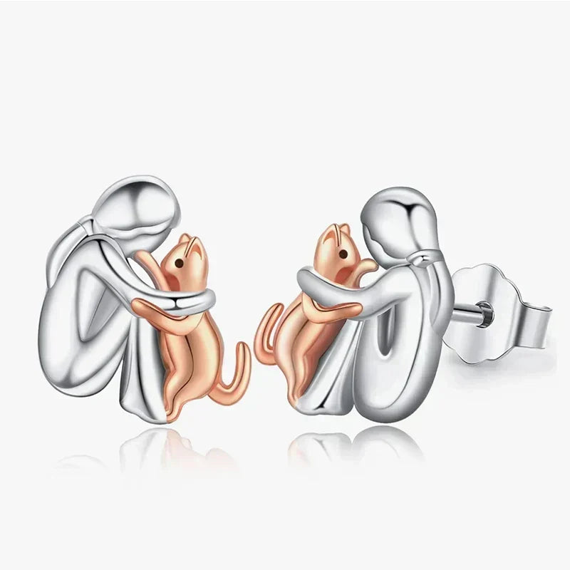 Avelien cat icon stud earrings in silver and rose gold, front view