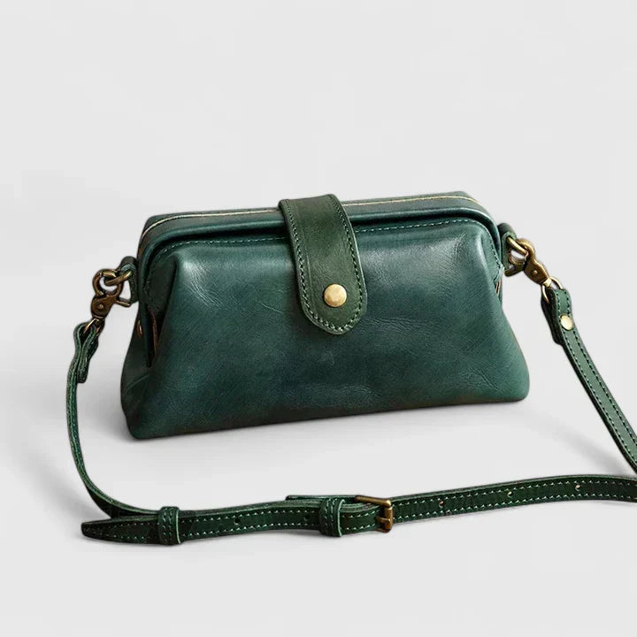 Isola structured leather shoulder bag in green, front view