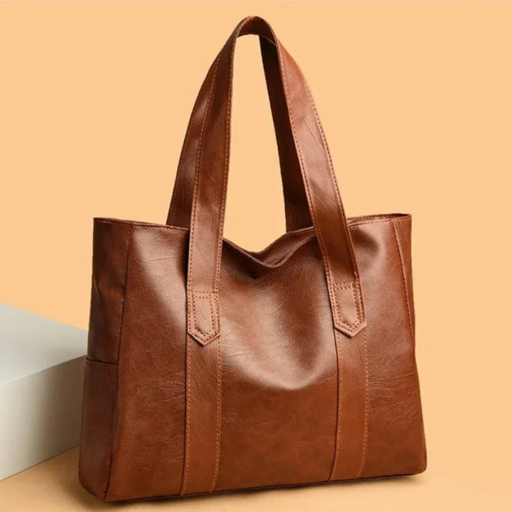 Susan minimalist shoulder bag in brown, angled front view