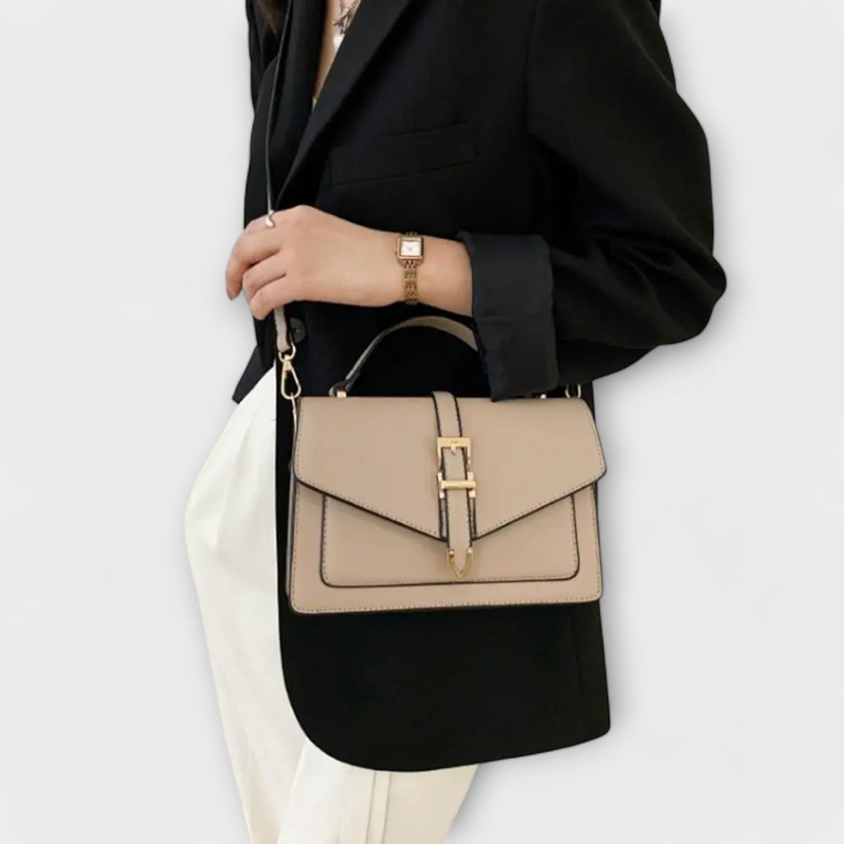 Olívia shoulder bag in khaki worn crossbody with black blazer