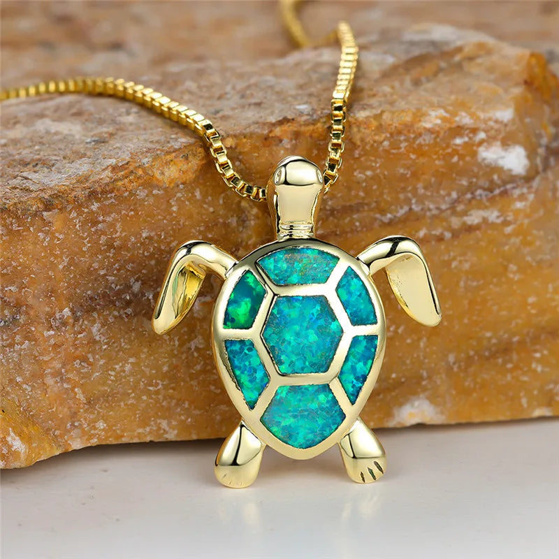 Opal turtle pendant necklace in gold tone with green shell panels