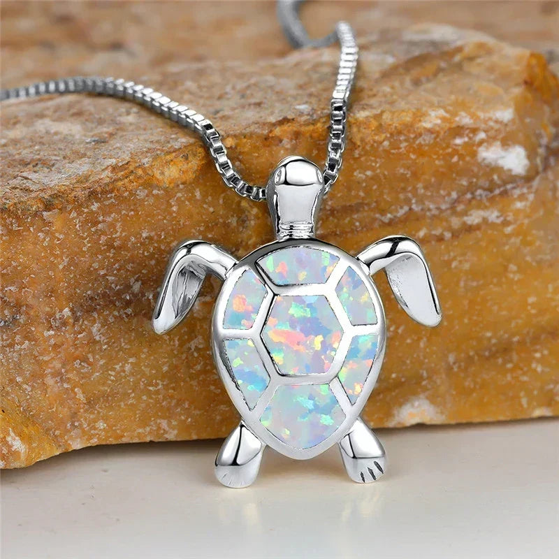 Opal turtle pendant necklace in silver tone with white shell panels