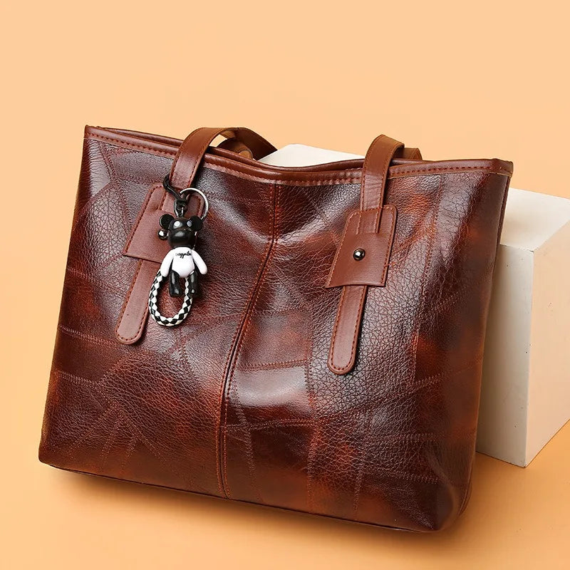 Susan vintage tote bag in brown, side angle showing patchwork panels