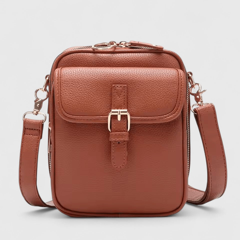 Seraphina crossbody bag in brown, front view with buckled flap