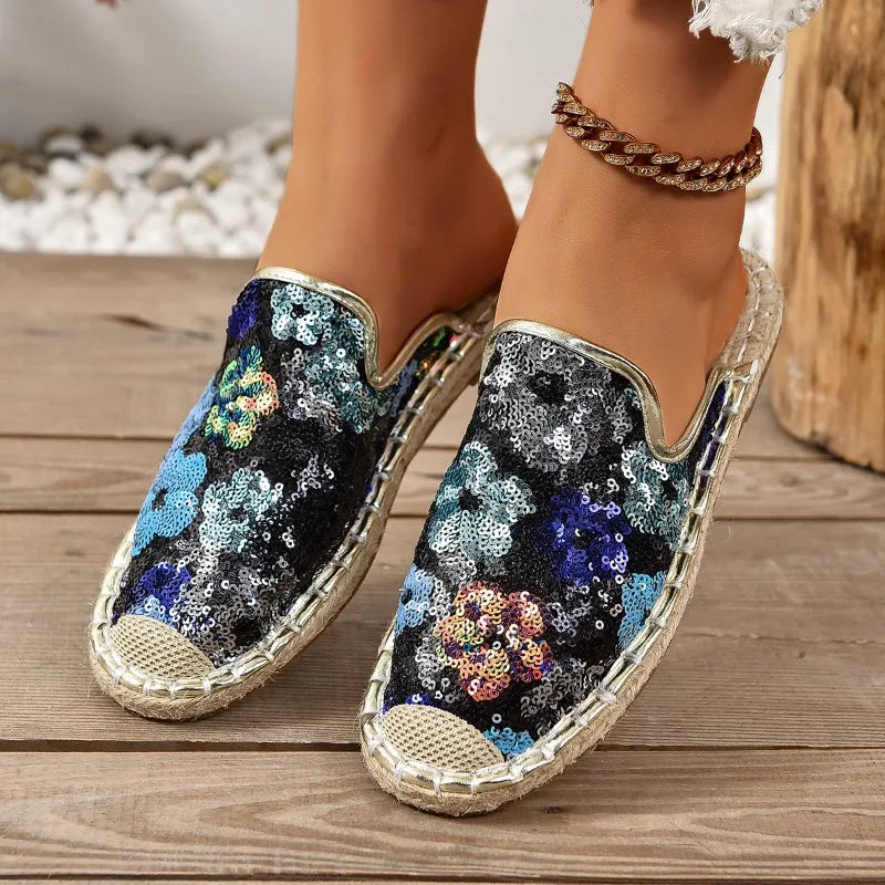 Sequinned slip-on flats in blue floral, worn front view