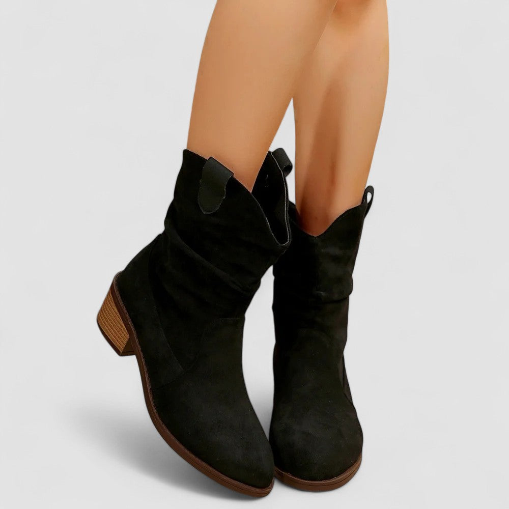 Cleo slouch western ankle boots in black, front view on model